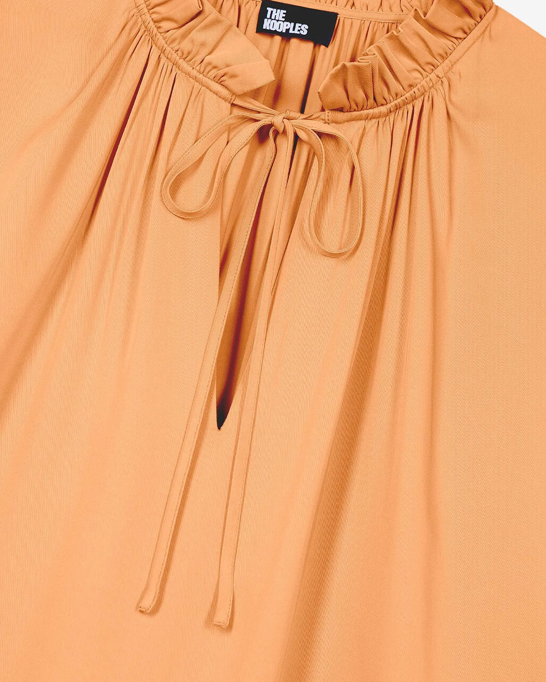 Blouse avec volants orange foncé