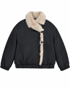 Manteau en fausse fourrure reversible beige et noir