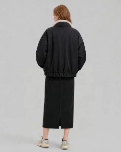 Manteau en fausse fourrure reversible beige et noir