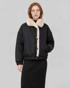 Manteau en fausse fourrure reversible beige et noir