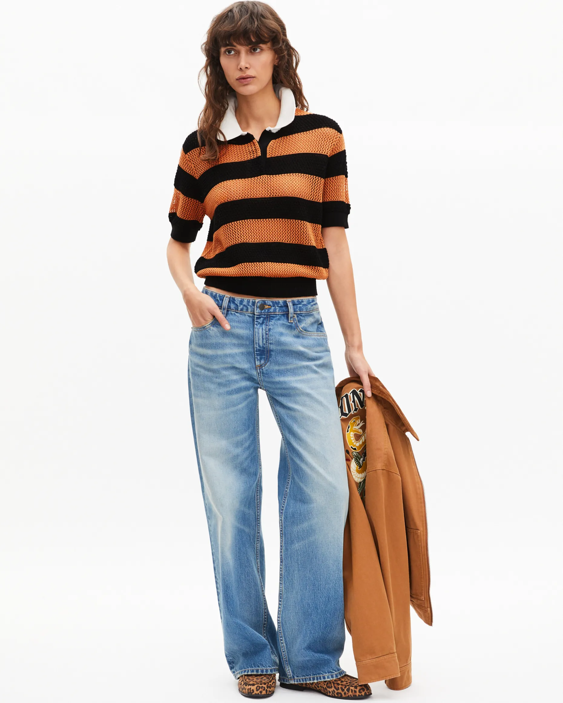 Polo en maille ajourée rayé orange et noir