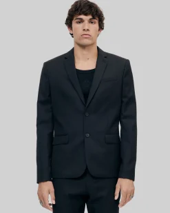 Veste de costume en laine noire coupe tailleur ajustée
