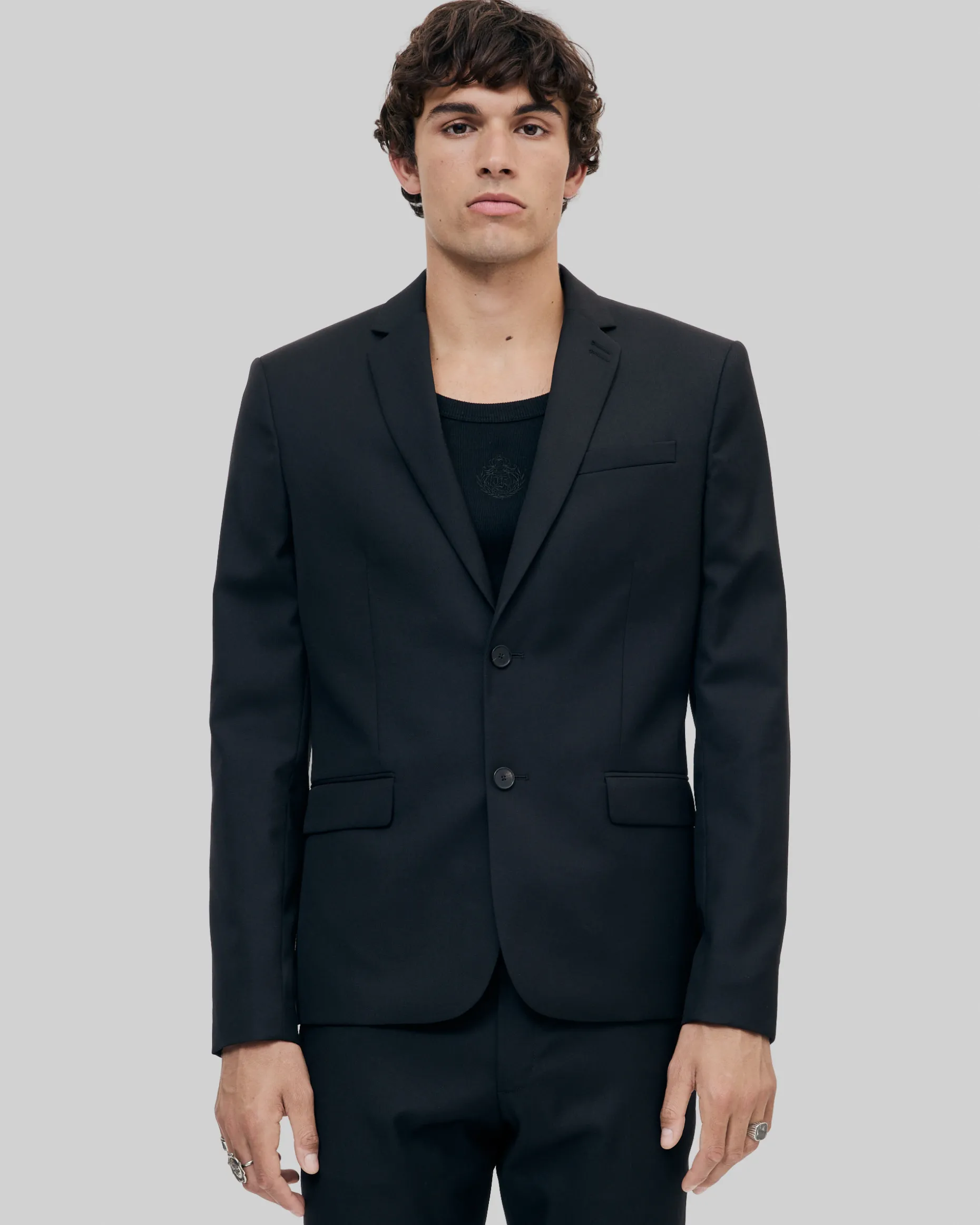 Veste de costume en laine noire coupe tailleur ajustée